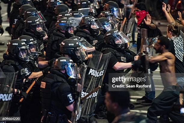 Police officers engage demonstrators September 21, 2016 in downtown Charlotte, NC. Protests in Charlotte began on Tuesday in response to the fatal...