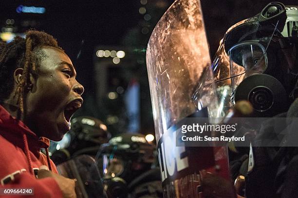 Demonstrator shouts at law enforcement during protests September 21, 2016 in Charlotte, NC. Protests in Charlotte began on Tuesday in response to the...