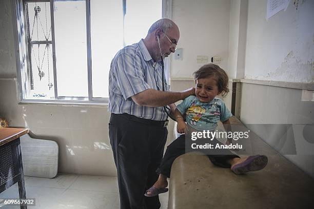 Syrian kid receives treatment at a hospital which is converted from a community clinic by 10 volunteered Syrian doctors after its cleansing of Daesh...