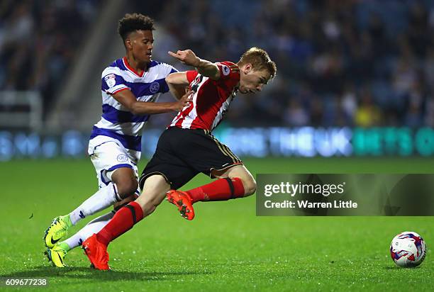 Ducan Watmore of Sunderland is tackled by Nicholas Hamalainen of Queens Park Rangers during the EFL Cup Third Round match between Queens Park Rangers...