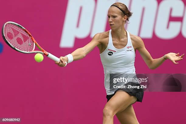 Viktorija Golubic of Switzerland returns a shot during the match against Anett Kontaveit of Spain on Day 4 of WTA Guangzhou Open on September 22,...