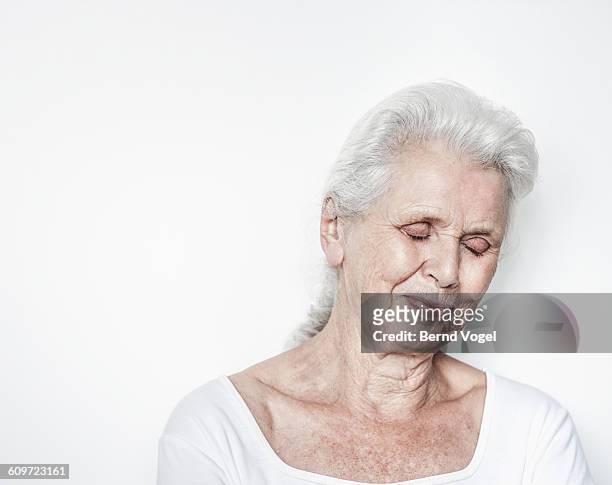 senior woman - soft smile stock pictures, royalty-free photos & images