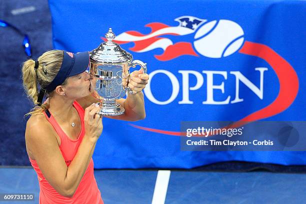 Open - Day 13 Angelique Kerber of Germany celebrates with the trophy after her win against Karolina Pliskova of the Czech Republic in the Women's...