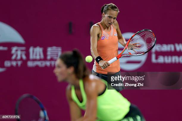 Viktorija Golubic of Switzerland in action with Ipek Soylu of Turkey during the doubles match against Martina Hingis of Switzerland and Jelena...