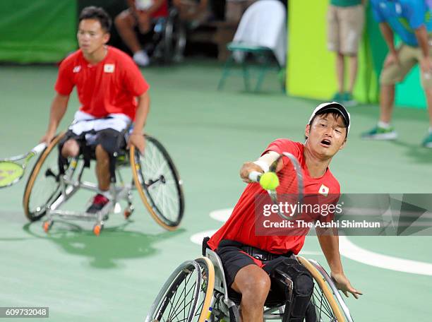 Takuya Miki of Japan plays a back hand during the Wheelchair Tennis Men's Doubles Semifinal against Stephane Houdet and Nicolas Peifer of France on...