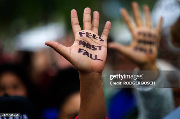 Hundreds of students hold a protest over student fee increases, on September 22, 2016 outside the South African parliament in Cape Town. Student...