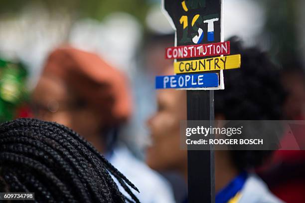 Hundreds of students hold a protest over student fee increases, on September 22, 2016 outside the South African parliament in Cape Town. Student...