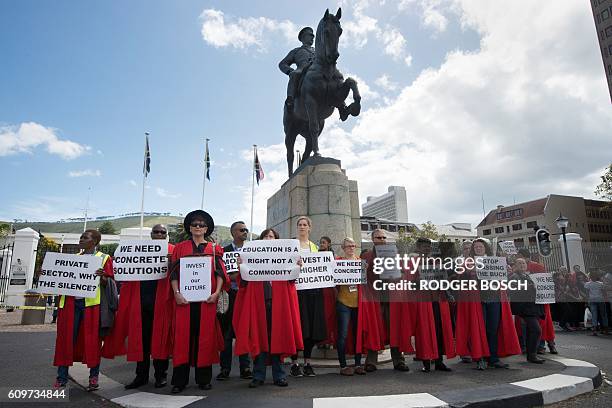 Hundreds of students hold a protest over student fee increases, on September 22, 2016 outside the South African parliament in Cape Town. Student...