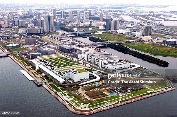 In this aerial image, The Toyosu market, buildings for stores of seafood intermediate wholesalers, seafood auctions, and fruit and vegetables are...