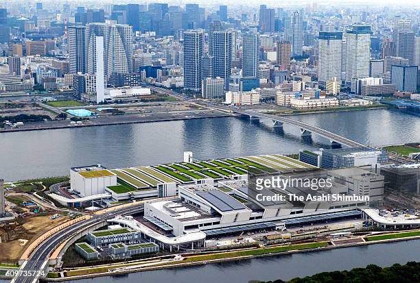 In this aerial image, The Toyosu market, buildings for stores of seafood intermediate wholesalers, seafood auctions, and fruit and vegetables are...