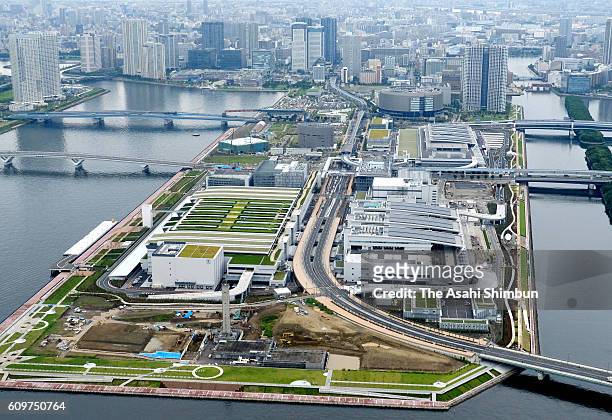 In this aerial image, The Toyosu market, buildings for stores of seafood intermediate wholesalers, seafood auctions, and fruit and vegetables are...