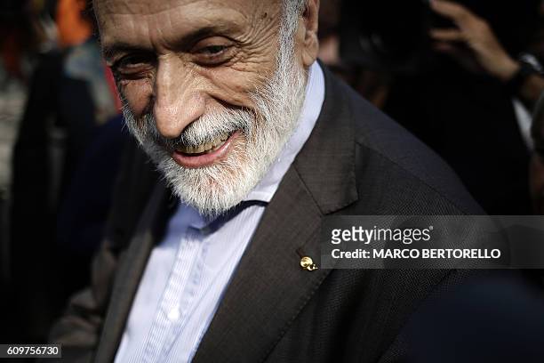 Chairman of the Slow Food Salone del Gusto and Terra Madre, Carlo Petrini smiles as he visits the show on September 22, 2016 in Turin. / AFP / MARCO...