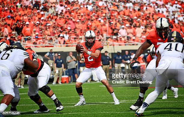 Quarterback Mason Rudolph of the Oklahoma State Cowboys takes a snap against the Pittsburgh Panthers September 17, 2016 at Boone Pickens Stadium in...