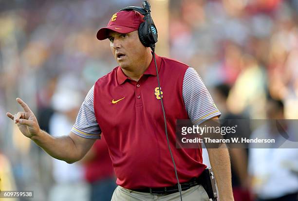 Head coach Clay Helton of the USC Trojans looks on from the sidelines against the Stanford Cardinal during the first half of their NCAA football game...