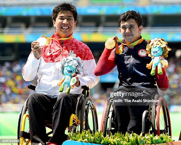 Silver medalist Tomoki Sato and gold medalist Raymond Martin of the United States celebrate on the podium at the medal ceremony for the Men's 1500m -...