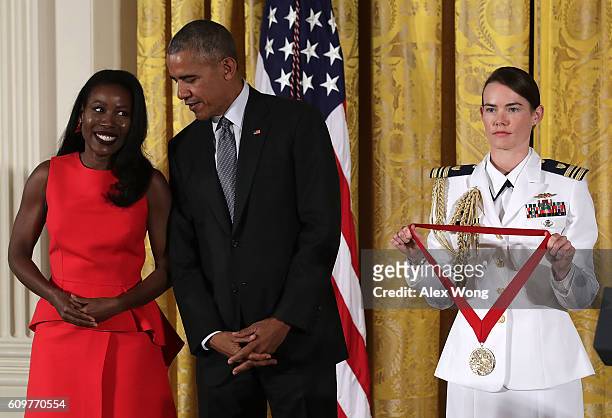 President Barack Obama presents the National Humanities Medal to journalist and author Isabel Wilkerson during an East Room ceremony at the White...