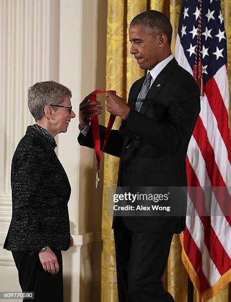 President Barack Obama presents the National Humanities Medal to radio host Terry Gross during an East Room ceremony at the White House September 22,...