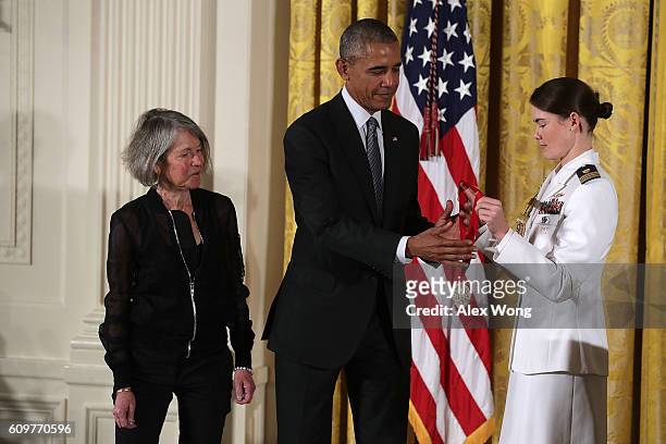 President Barack Obama presents the National Humanities Medal to poet Louise Gluck during an East Room ceremony at the White House September 22, 2016...