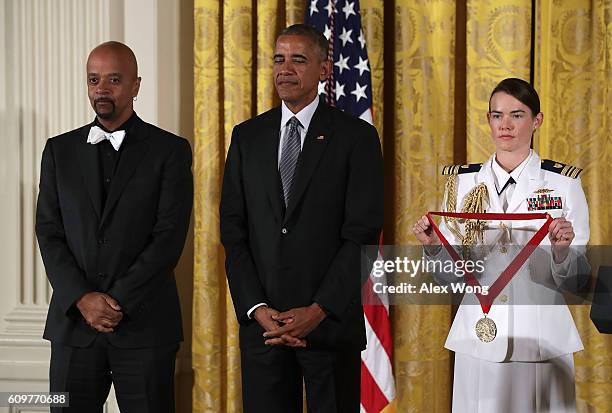 President Barack Obama presents the National Humanities Medal to author James McBride during an East Room ceremony at the White House September 22,...