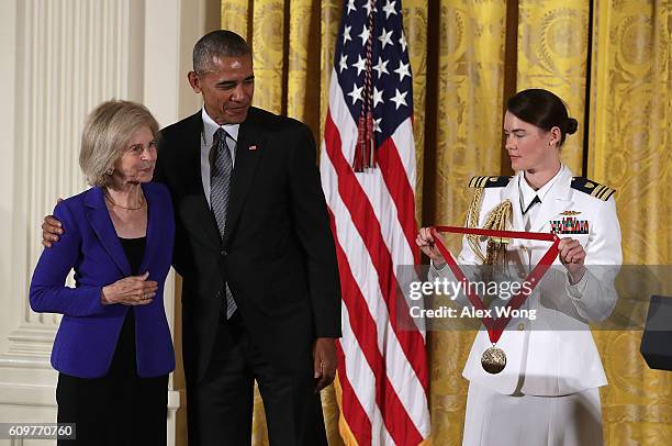 President Barack Obama presents the National Humanities Medal to historian Elaine Pagels during an East Room ceremony at the White House September...