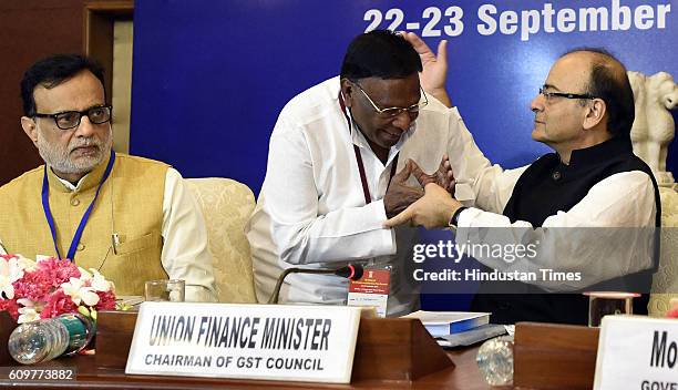 Finance Minister Arun Jaitley with Chief Minister of Puducherry V. Narayanasamy and Financial Services Secretary Hasmukh Adhia during the first GST...