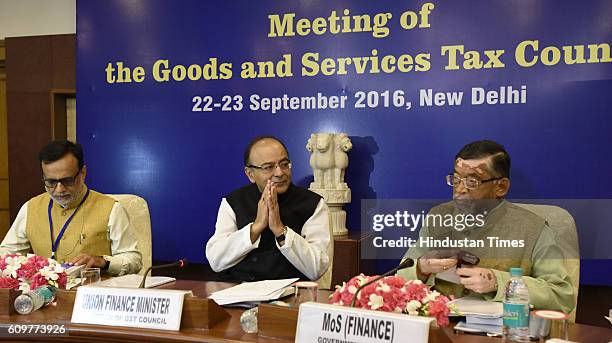 Finance Minister Arun Jaitley , Financial Services Secretary Hasmukh Adhia and Union Minister of State for Finance Santosh Kumar Gangwar arrive for...