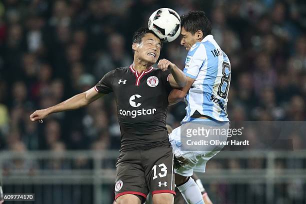 Ryo Miyaichi of Pauli and Karim Matmour of Muenchen compete for the ball during the Second Bundesliga match between FC St. Pauli and TSV 1860...
