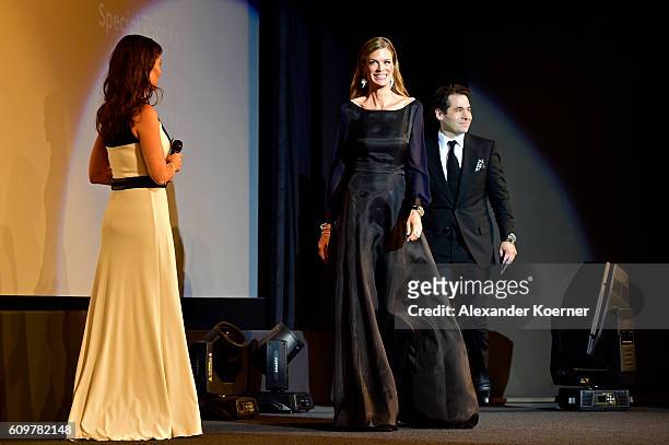Sandra Studer welcomes Festival director Nadja Schildknecht and Festival director Karl Spoerri on the stage during the 'Lion' premiere and opening...
