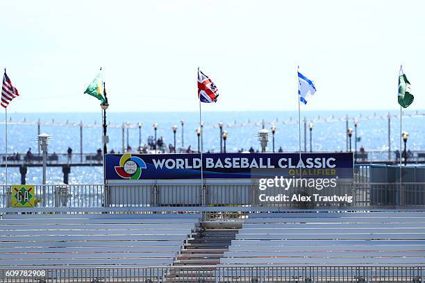 Flags of the countries represented in the Brooklyn Qualifier are seen waving above the stadium during Game 1 of the 2016 World Baseball Classic...