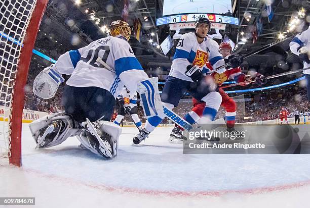 Valtteri Filppula and Tuukka Rask of Team Finland defend their net against Team Russia during the World Cup of Hockey game at Air Canada Centre on...