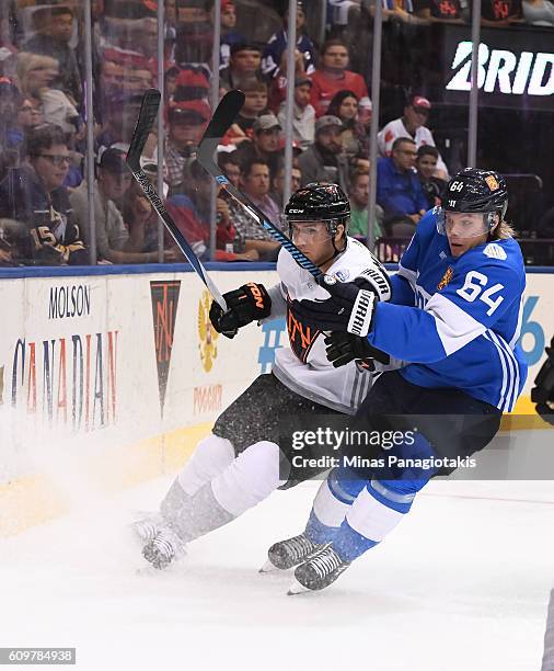 Ryan Murray of Team North America battles for position with Mikael Granlund of Team Finland during the World Cup of Hockey 2016 at Air Canada Centre...