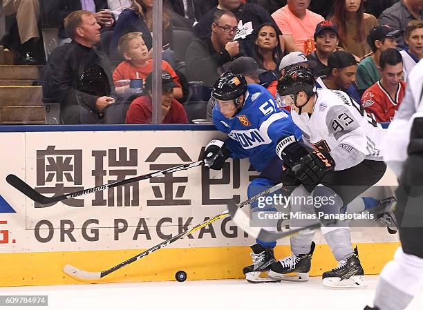 Valtteri Filppula of Team Finland battles for the puck with Ryan Nugent-Hopkins of Team North America during the World Cup of Hockey 2016 at Air...