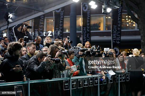 Photographers work during the 'Lion' premiere and opening ceremony of the 12th Zurich Film Festival at Kino Corso on September 22, 2016 in Zurich,...