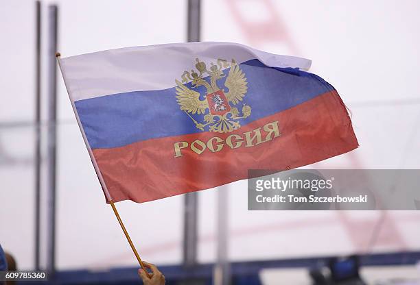 Fan of Team Russia waves a Russian flag against Team Finland during the World Cup of Hockey tournament at the Air Canada Centre on September 22, 2016...