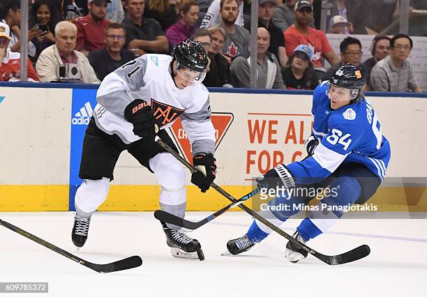 Dylan Larkin of Team North America battles for the puck with Mikael Granlund of Team Finland during the World Cup of Hockey 2016 at Air Canada Centre...