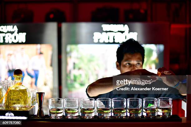 Bartender prepares drinks at the Tequila Patron bar during the opening party during the 12th Zurich Film Festival on September 22, 2016 in Zurich,...