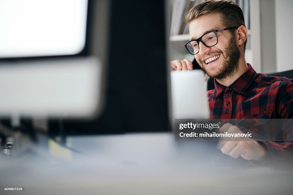 Man having an exciting call in the office