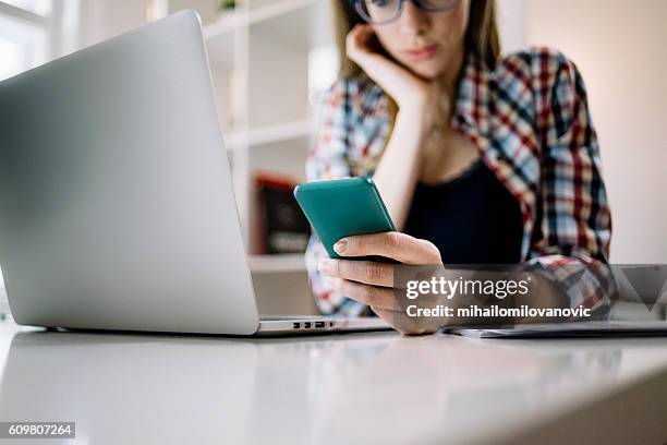 young architect checking latest updates - concept updates stockfoto's en -beelden