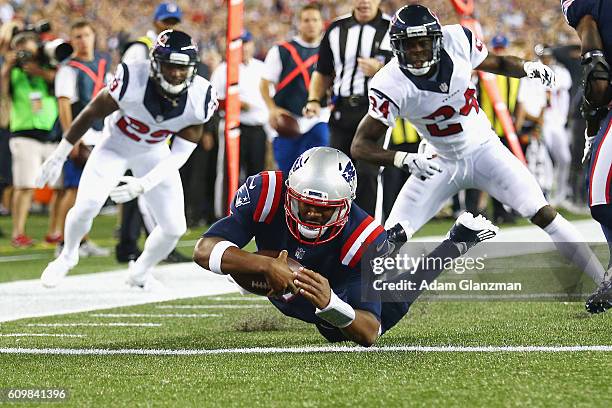 Jacoby Brissett of the New England Patriots dives for a touchdown during the first quarter against the Houston Texans at Gillette Stadium on...