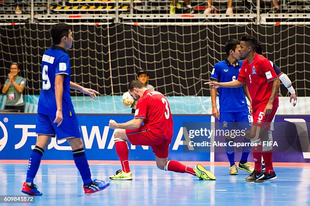 Thiago Bolinha of Azerbaijan celebrates with his teammate Fineo after scoring his team's fifth goal during the FIFA Futsal World Cup Round of 16...