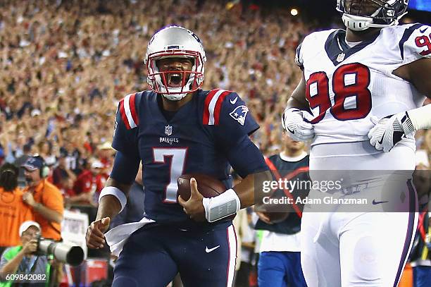 Jacoby Brissett of the New England Patriots celebrates scoring a touchdown during the first quarter against the Houston Texans at Gillette Stadium on...