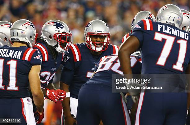 Jacoby Brissett of the New England Patriots huddles during the first half against the Houston Texans at Gillette Stadium on September 22, 2016 in...
