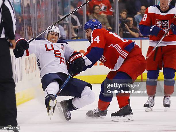 Roman Polak of Team Czech Republic checks Zach Parise of Team USA during the third period at the World Cup of Hockey tournament at the Air Canada...