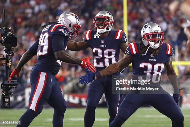 LeGarrette Blount of the New England Patriots celebrates with James White and Brandon Bolden after scoring a touchdown during the third quarter...