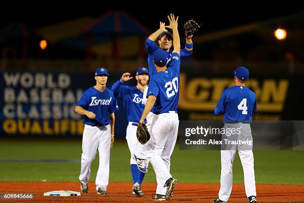 Members of Team Israel celebrate after defeating Team Great Britain in Game 2 of the 2016 World Baseball Classic Qualifier at MCU Park on Thursday,...