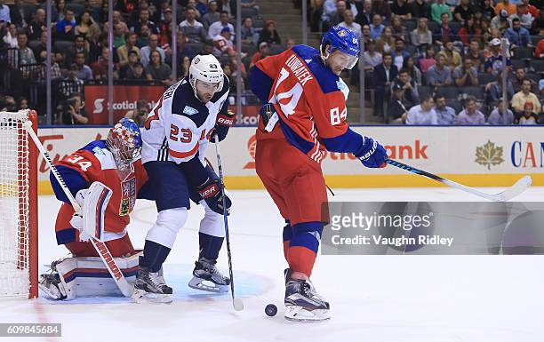 Kyle Palmieri of Team USA battles for a loose puck with Tomas Kundratek in front of Petr Mrazek of Team Czech Republic during the World Cup of Hockey...