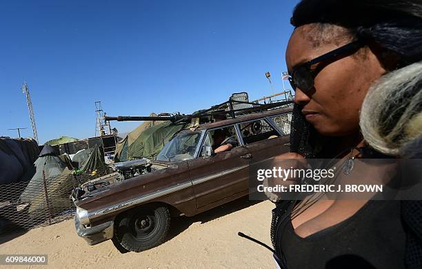 Festival goers attend the first day of Wasteland Weekend in the high desert community of California City in the Mojave Desert, California, where...