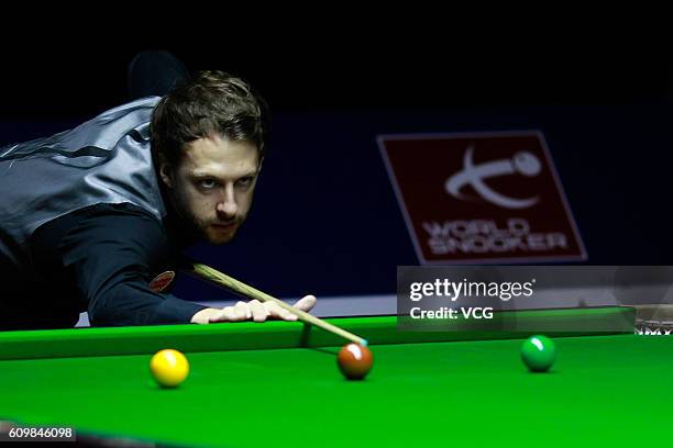 Judd Trump of England plays a shot in the second round match against Michael White of Wales on day four of the Shanghai Masters 2016 at Shanghai...