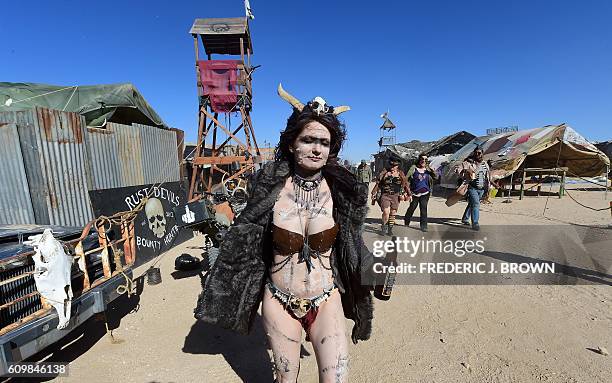 Festival goers attend the first day of Wasteland Weekend in the high desert community of California City in the Mojave Desert, California, where...