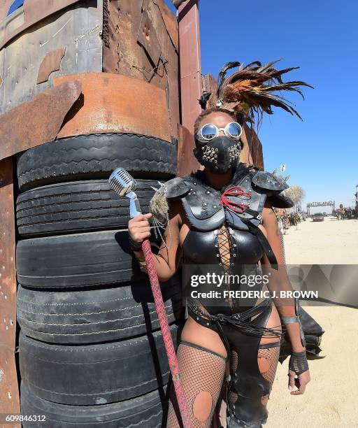 Festival goers attend the first day of Wasteland Weekend in the high desert community of California City in the Mojave Desert, California, where...